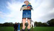Artist Andrea Deans poses with the 11-metre effigy of former British Prime Minister Liz Truss unveiled today ahead of the Edenbridge Bonfire Celebrations in Edenbridge, Britain, November 2, 2022. Reuters/Hannah McKay