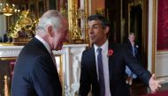 King Charles III greets Prime Minister Rishi Sunak, during a reception at Buckingham Palace, London, ahead of the Cop27 Summit, November 4, 2022. (Jonathan Brady/Pool via REUTERS)