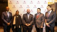 Officials pose for a group photo during the event.