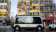 In this photo taken in Seoul on November 23, 2022, a bus is seen parked at one of its two designated stops on the country's first self-driving bus route. Photo by Anthony Wallace / AFP