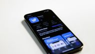 In this photo illustration, the Twitter app is seen in the Apple App Store on an Apple iPhone 13 Pro in Washington, DC, on November 28, 2022. (Photo by SAMUEL CORUM / AFP)

