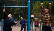 Elderly people exercise in the morning at a park in Beijing, China November 10, 2022. Reuters/Tingshu Wang