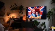 A woman watches an episode of the newly released Netflix docuseries 