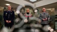 German Defence Minister Christine Lambrecht (centre) is flanked by Eberhard Zorn (right), Inspector General of the German Armed Forces Bundeswehr, and Ingo Gerhartz, Inspector of the Air Force, as she gives a press conference on December 14, 2022 in Berlin. (Photo by John MacDougall / AFP)