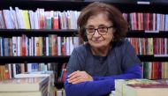 Bookshop director Salwa Gaspard poses for pictures at Middle Eastern specialist bookshop, Al Saqi Books, in Bayswater, west London, on December 14, 2022. (Photo by Isabel Infantes / AFP)