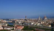 This file photo taken on September 14, 2020 taken from the heights of the city shows a general view of Florence with the Arno river, the oldo bridge, the Palazzo Vecchio (C), the Giotto bell tower and the Santa Maria del Fiore Cathedral or Duomo (R) in the center of Florence. (Photo by MIGUEL MEDINA / AFP)
 