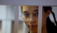 US basketball player Brittney Griner, who was detained at Moscow's Sheremetyevo airport and later charged with illegal possession of cannabis, stands inside a defendants' cage before a court hearing in Khimki outside Moscow on August 4, 2022.  File Photo / Reuters
