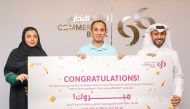 Commercial Bank officials with a winner of ‘We’re Seeing Double’ campaign.