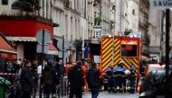 French police and firefighters secure a street after gunshots were fired killing two people and injuring several in a central district of Paris, France, December 23, 2022. REUTERS/Sarah Meyssonnier