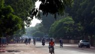People ride bicycles and motorcycles on a street in Ouagadougou, Burkina Faso, September 17, 2015. File Photo / Reuters