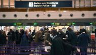In this file photo taken on February 1, 2021, travellers queue at the immigration desk of Roissy Charles-de-Gaulle international airport in Paris, France, as new Covid-19 border restrictions come into effect. (Photo by Christophe Archambault / AFP)
