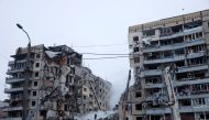 Emergency personnel work at the site where an apartment block was heavily damaged by a Russian missile strike, amid Russia's attack on Ukraine, in Dnipro, Ukraine January 15, 2023. REUTERS/Clodagh Kilcoyne