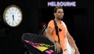 Spain's Rafael Nadal leaves the court after losing to USA's Mackenzie McDonald in their men's singles match on day three of the Australian Open tennis tournament in Melbourne on January 18, 2023. (Photo by MANAN VATSYAYANA / AFP) 
