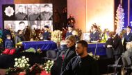Ukraine's President Volodymyr Zelenskiy and first lady Olena Zelenska attend a memorial ceremony for Ukrainian Interior Minister Denys Monastyrskyi, his deputy and officials who died in the helicopter crash near Kyiv, in Kyiv, Ukraine, January 21, 2023. Reuters/Nacho Doce