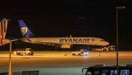 A Ryanair plane is seen on the runway, after landing at Athens' International Eleftherios Venizelos airport, following a bomb threat in midair, on the outskirts of Athens, Greece, January 22, 2023. (REUTERS/Alkis Konstantinidis)