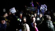 Pro-immigration protestors argue with an anti-immigration protestor, during a vigil calling for the Manston migrant processing centre to be closed, in Manston, Britain, on November 2, 2022. File Photo / Reuters
