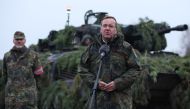German Defence Minister Boris Pistorius stands in front of a Puma tank as he addresses troops of the German armed forces Bundeswehr at a military training area in Altengrabow near Moeckern, eastern Germany, on January 26, 2023. (Photo by Ronny HARTMANN / AFP)