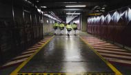This photograph taken on January 26, 2023, shows people walking in the manufacturing workshop Georges Besse 1, an Uranium enrichment site at the Tricastin nuclear power plant in Saint-Paul-Trois-Chateau, southern France. (Photo by OLIVIER CHASSIGNOLE / AFP)
