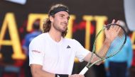 Greece's Stefanos Tsitsipas celebrates after victory against Russia's Karen Khachanov during their men's singles semi-final match on day twelve of the Australian Open tennis tournament in Melbourne on January 27, 2023. (Photo by Martin KEEP / AFP)