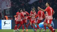Union Berlin's Sheraldo Becker (third left) celebrates scoring his team's second goal with team mates during the German Bundesliga match between Hertha Berlin and 1 FC Union Berlin at the Olympic Stadium in Berlin on January 28, 2023. (Photo by Ronny Hartmann / AFP)