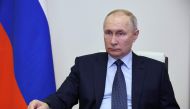 Russian President Vladimir Putin chairs a meeting on the restoration of residential infrastructure in the border areas destroyed during emergency situations, via a video conference at the Novo-Ogaryovo state residence, outside Moscow, on February 1, 2023. (Photo by Mikhail Klimentyev / SPUTNIK / AFP)