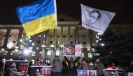 Supporters of Georgia's detained ex-president Mikheil Saakashvili rally outside the Tbilisi City Court on February 6, 2023. - A Georgian court on February 6 rejected ailing ex-president Mikheil Saakashvili's bid to get a six-year sentence for alleged abuse of office deferred over poor health.  (Photo by Vano SHLAMOV / AFP)