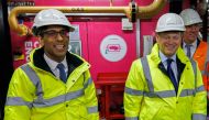 Britain's Prime Minister Rishi Sunak (left) and Britain's Secretary of State for Energy Security and Net Zero Grant Shapps as they tour the Combined Heat and Power Plant (CHP) at King's Cross in London on February 7, 2023. (Photo by Jamie Lorriman / POOL / AFP)