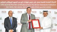 UDC President, CEO and Member of the Board Ibrahim Jassim Al Othman receives the certificates from Jon Wilks, the British Ambassador to the State of Qatar.