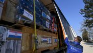 A driver closes the tarpaulin of a truck, containing humanitarian aid collected by Croatian government, Caritas and the Croatian Red Cross and lining-up at the logistics center of the directorate of civil protection in Jastrebarsk, near Zagreb, on February 10, 2023, ready to deliver to areas of Turkey after a 7.8-magnitude earthquake struck early February 6 near the Turkish-Syrian border. (Photo by DENIS LOVROVIC / AFP)