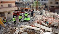Rescuers sift through the rubble of a collapsed building in Jableh in the province of Latakia, northwest of the Syrian capital, on February 11, 2023. (Photo by Karim Sahib / AFP)