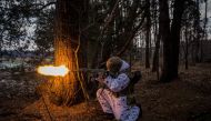 A Ukrainian serviceman fires during a joint military training of armed forces, national guards, border guards and Security Service of Ukraine in Rivne region, near the border with Belarus, on February 11, 2023, amid the Russian invasion of Ukraine. (Photo by Dimitar Dilkoff / AFP)