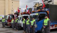 Trucks loaded with humanitarian aid provided by Lebanese Shiite group Hezbollah set out for Syria from the Lebanese capital's southern suburb on February 12, 2023, in the aftermath of a deadly earthquake. (Photo by ANWAR AMRO / AFP)