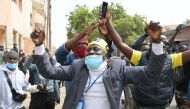 Supporters of Senegal's opposition leader Ousmane Sonko demonstrate at the courthouse where his defamation trial against the Senegal Minister of Tourism Mame Mbaye Niang is being held in Dakar on February 16, 2023. (Photo by SEYLLOU / AFP)