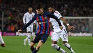 Barcelona's Spanish midfielder Pedri (left) fights for the ball with Manchester United's Brazilian midfielder Fred during the UEFA Europa League round of 32 first-leg match between FC Barcelona and Manchester United at the Camp Nou stadium in Barcelona, on February 16, 2023. (Photo by Josep LAGO / AFP)