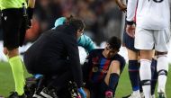 Barcelona's Spanish midfielder Pedri receives medical attention after a fall during the UEFA Europa League round of 32 first-leg football match between FC Barcelona and Manchester United at the Camp Nou stadium in Barcelona, on February 16, 2023. (Photo by Josep LAGO / AFP)