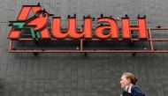 In this file photo taken on August 03, 2020, the logo of French supermarket Auchan is pictured on the wall of a shopping mall in Moscow on August 3, 2020.  (Photo by Kirill Kudryavtsev / AFP)