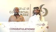 A winner from the second draw receiving the prize.