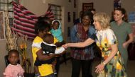 US First Lady Jill Biden and Namibia's First Lady Monica Geingos (3rd right) meet two mothers, Linea and Monica, and their children that are beneficiaries of Development Aid from People to People (DAPP), at the Hope Initiative Southern Africa in Windhoek on February 23, 2023. (Photo by Tara Mette / AFP)