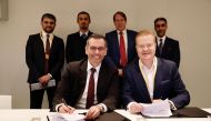 Officials of Ooredoo and Nokia signing the agreement.