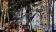 This handout picture taken and released by the Ukrainian Emergency Ministry press service on March 2, 2023, shows rescuers work on a residential building destroyed after a missile strike, in Zaporizhzhia, amid the Russian invasion of Ukraine. Photo by Handout / UKRAINE EMERGENCY MINISTRY PRESS SERVICE / AFP