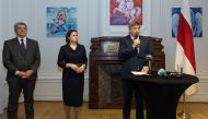 Leader of the Belarusian democratic movement Svetlana Tikhanovskaya (centre) and Flemish Minister President Jan Jambon (R) attend the opening of the 'Mission of Democratic Belarus', diplomatic offices to serve the Belarusian opposition in Brussels, on March 1, 2023. (Photo by JAMES ARTHUR GEKIERE / Belga / AFP)