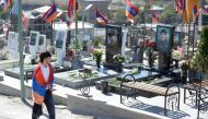 Relatives and friends of those killed in six weeks of fighting for control of the disputed Nagorno-Karabakh region visit the Yerablur Military Memorial Cemetery in Yerevan on September 27, 2022. File photo / AFP
