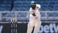 South Africa's Temba Bavuma watches the ball after playing a shot during the third day of the second Test cricket match between South Africa and West Indies at The Wanderers Stadium in Johannesburg on March 10, 2023. (Photo by PHILL MAGAKOE / AFP)