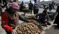 In this file photo merchants present their desert truffles at a market in the city of Hama in west-central Syria on March 6, 2023. - Suspected Islamic State group militants killed three truffle hunters and kidnapped at least 26 others in northern Syria on March 11, the Syrian Observatory for Human Rights said, in the latest grisly incident during this year's harvest. (Photo by LOUAI BESHARA / AFP)