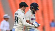 Australia's captain Steve Smith (L) greets India's Virat Kohli after his dismissal during the fourth day of the fourth and final Test cricket match between India and Australia at the Narendra Modi Stadium in Ahmedabad on March 12, 2023. (Photo by Punit Paranjpe / AFP)