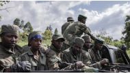 M23 rebels attending ceremonies at Rumangabo on January 6 when they handed back an army base they had seized. Guerchom Ndebo / AFP
