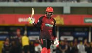 Chris Gayle celebrates his half century yesterday.