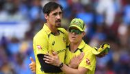 Australia's Mitchell Starc (L) celebrates after taking the wicket of India's Mohammed Siraj (not pictured) during the second one-day international (ODI) cricket match between India and Australia at the Y.S. Rajasekhara Reddy Cricket Stadium in Visakhapatnam on March 19, 2023. (Photo by Noah SEELAM / AFP)