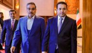 In this handout photo released by Iraq's National Security press office, Iraq's National Security Advisor Qasim al-Araji (right) meets with the Secretary of Iran's Supreme National Security Council Ali Shamkhani (centre) in Baghdad on March 19, 2023. (Photo by IRAQI SECURITY MEDIA CENTRE / AFP)
