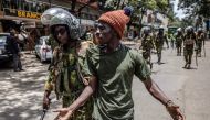 A Kenyan Police officer arrests a protester following clashes with opposition supporters in Nairobi, Kenya on March 20, 2023.  (Photo by Luis Tato / AFP)